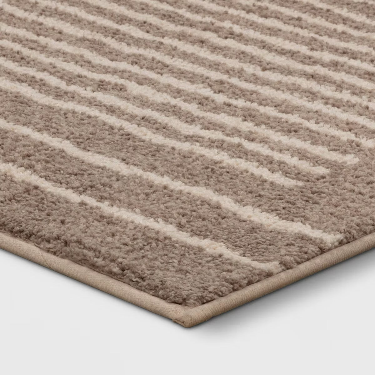 2'6" x 4' Washable Knitted Stripe Accent Rug Tan - Threshold